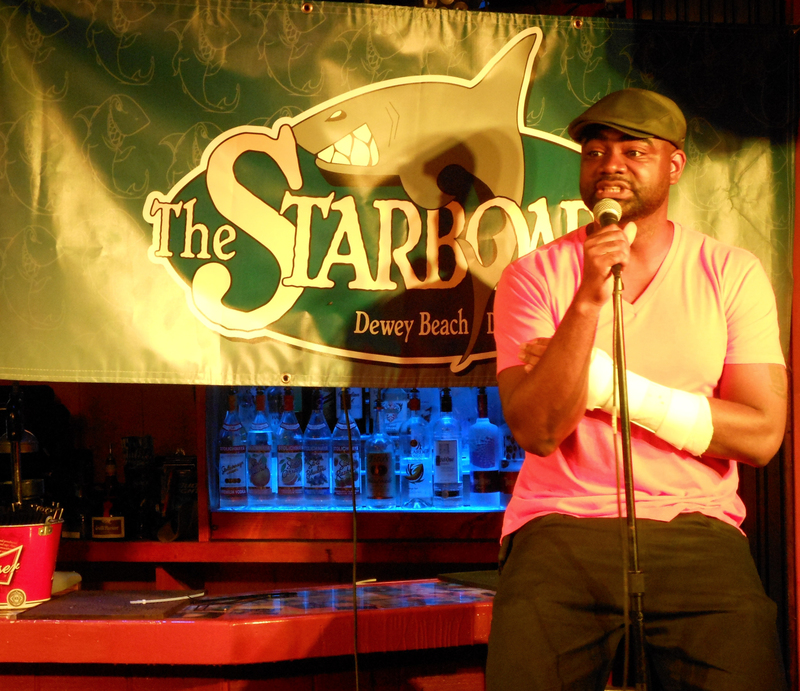 Comedian Harris Stanton performs at the Starboard's Comedy Night Aug. 12. It was the first time he had been on stage since he was involved in an accident that left one man dead, comedian Tracy Morgan seriously injured and others with minor injuries. Stanton is still wearing a removable cast on his left wrist, which was broken during the accident. BY CHRIS FLOOD